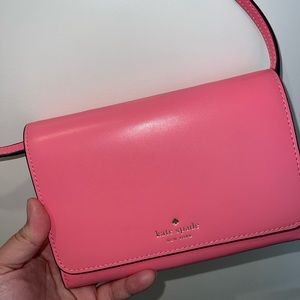 Bright pink Kate Spade mini purse. Never used before, brand new.